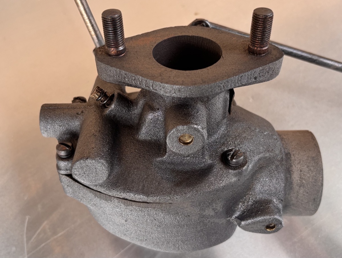 Marvel carburetor after laser cleaning — bare metal restored