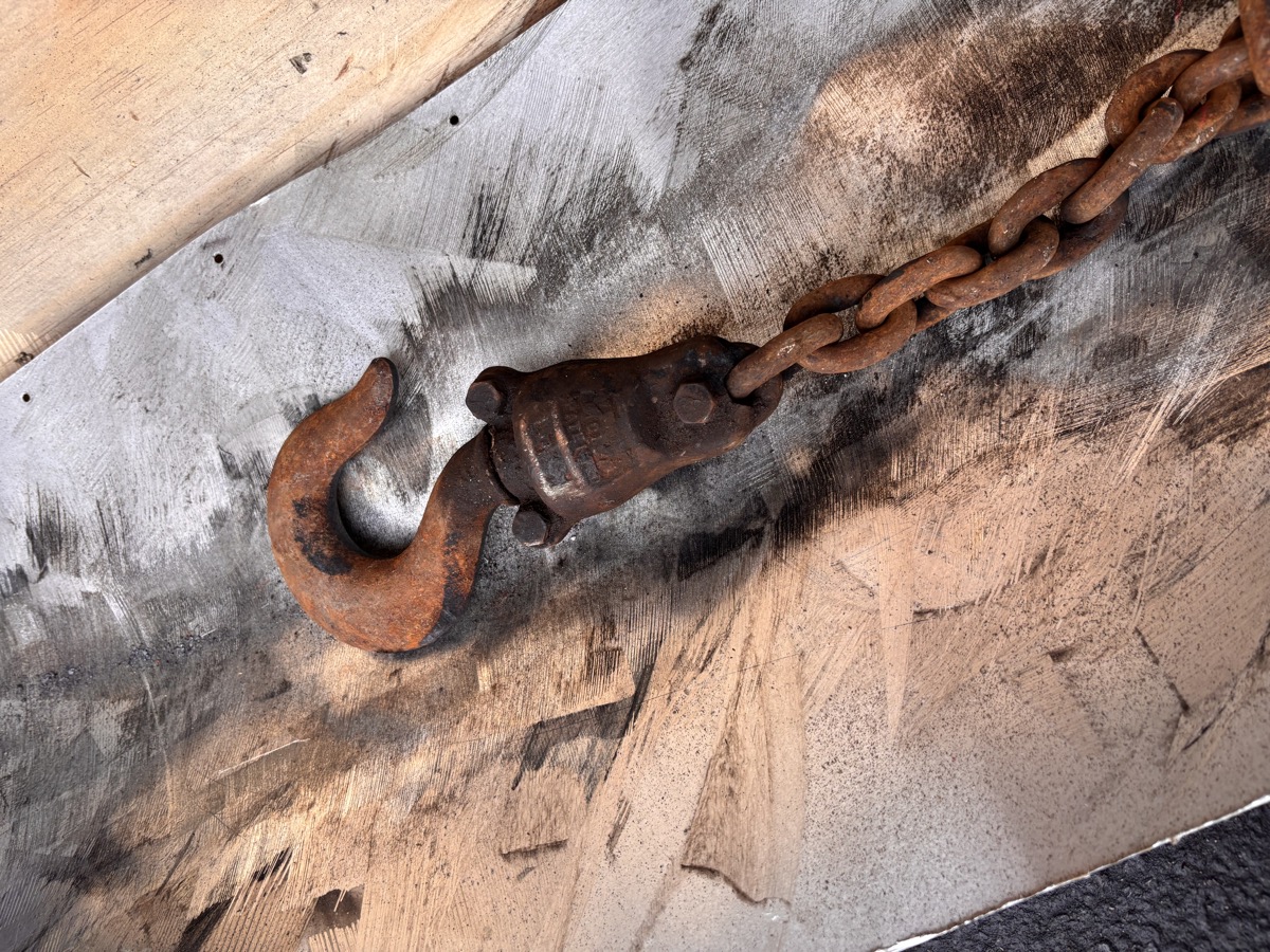 Rusted Wright hoist hook and chain before laser cleaning