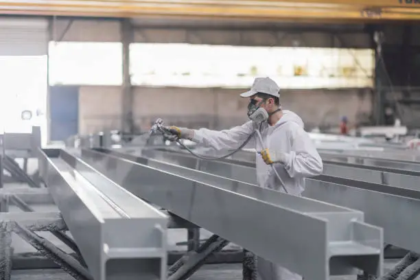 Paint being removed from metal surface
